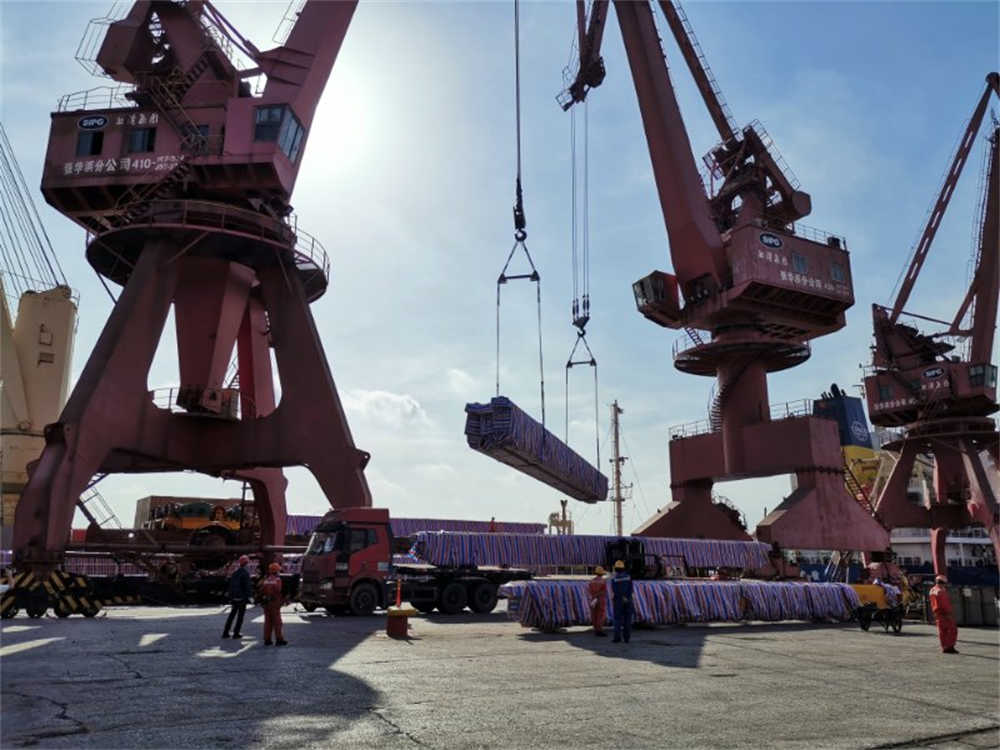 Overhead crane loading ship in port